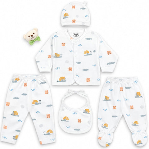 A 5-piece baby clothing set laid out on a white background, including a hat, cardigan, pants, footed sleeper, bib, and a small plush bear accessory. The set is white with a colorful print of snails, clouds, and small animals.